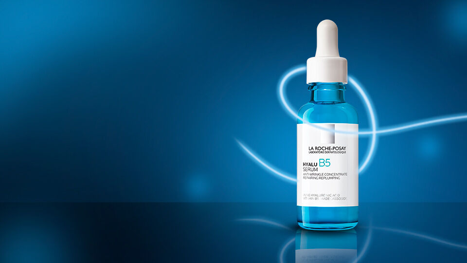 La Roche-Posay Hyalu B5 serum bottle and blue hydration swirl background