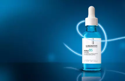 La Roche-Posay Hyalu B5 serum bottle and blue hydration swirl background