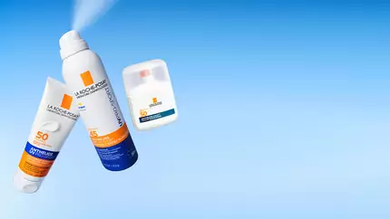 La Roche-Posay sunscreen bottles on a blue background