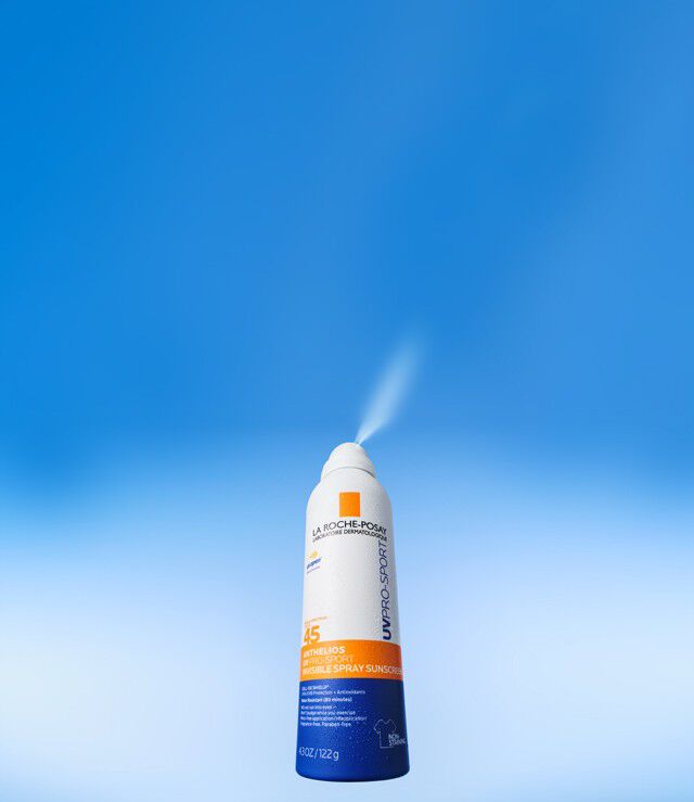 UV Pro Sport Spray bottle on blue background